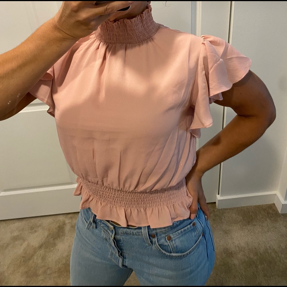 Woman’s cap sleeve mock neck peplum crop top
